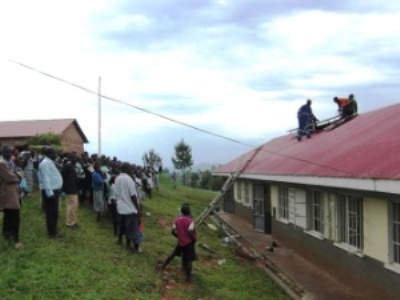 Installation of donated Kyocera solar power generating system at Ugandan school