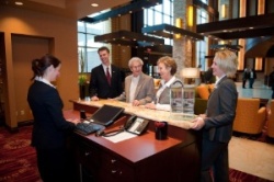 John Q. Hammons officially opened the luxury Marriott Bloomington - Normal Hotel & Conference Center in Illinois with General Manager Jeff Pritts (left) and Director of Sales & Marketing Heather VanVoorhis (right) welcoming the hotel