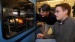 Timothy D. Sands, at left, director of Purdue's Birck Nanotechnology Center in Discovery Park, and graduate student Mark Oliver, operate a 