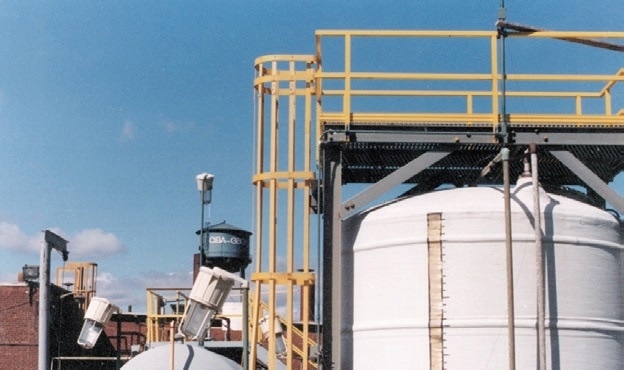 This fiberglass ladder and cage provide worker access to a maintenance platform at a Ciba Geigy plant in the northeastern United States.