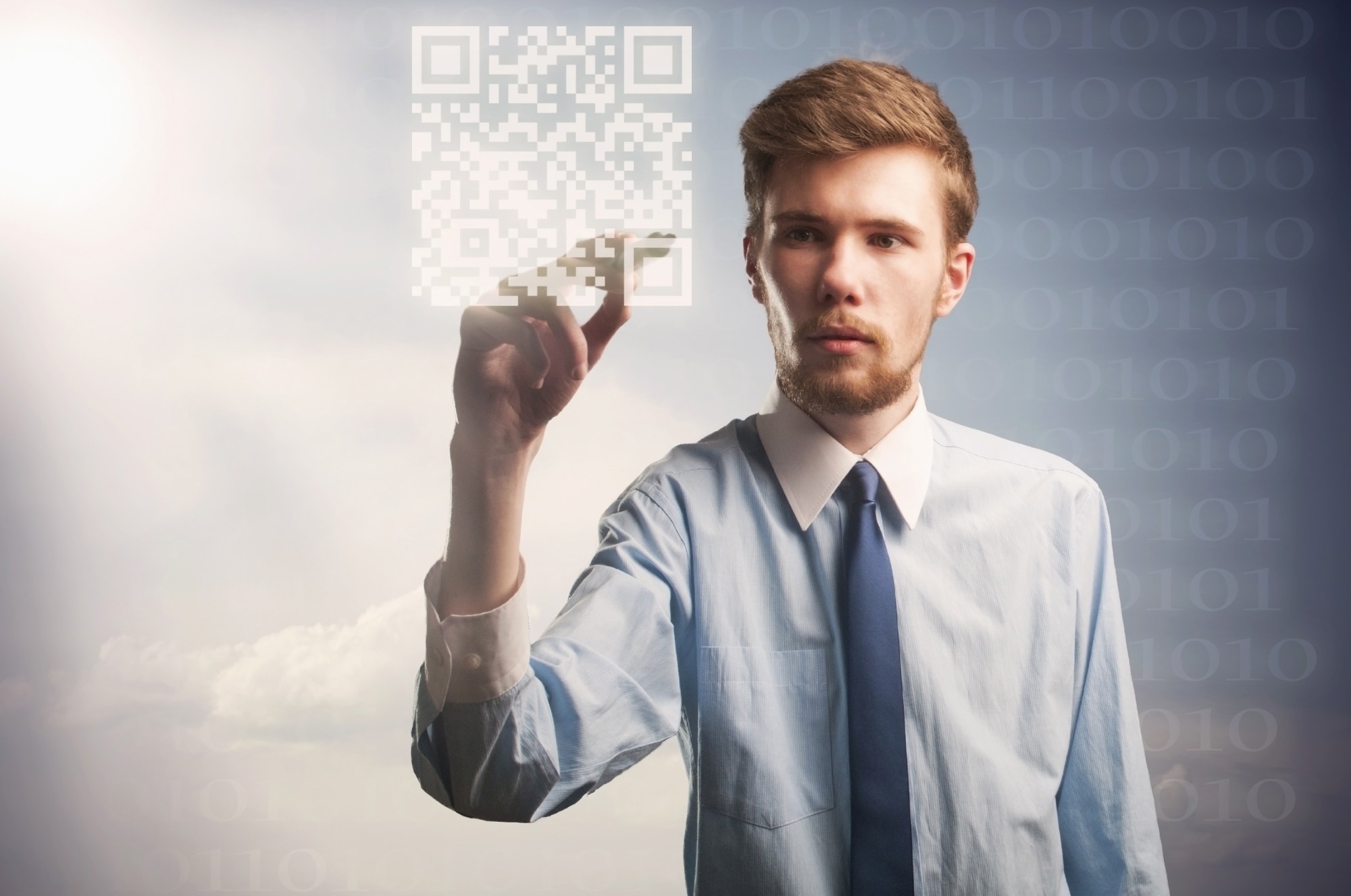 a young businessman painting qr code