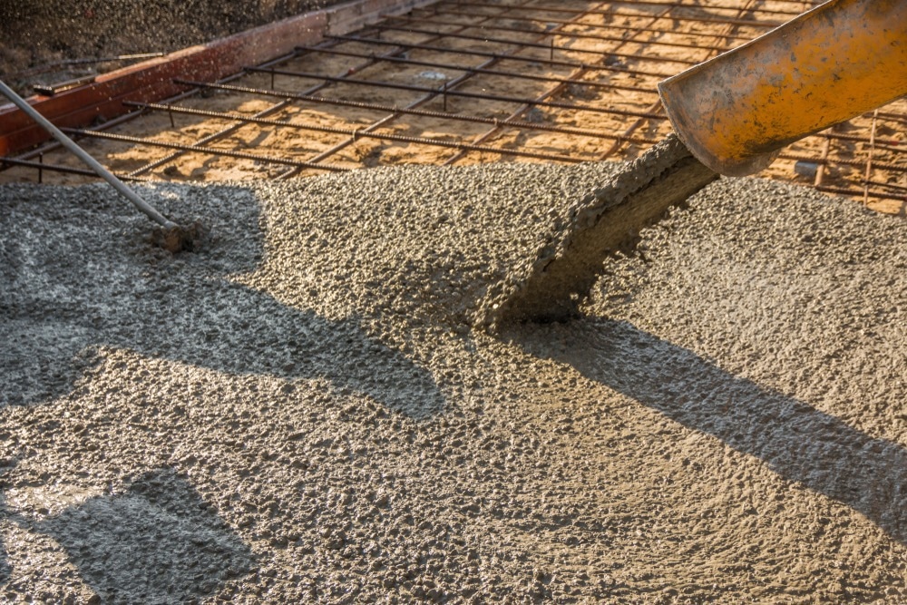 concrete being poured onto ground