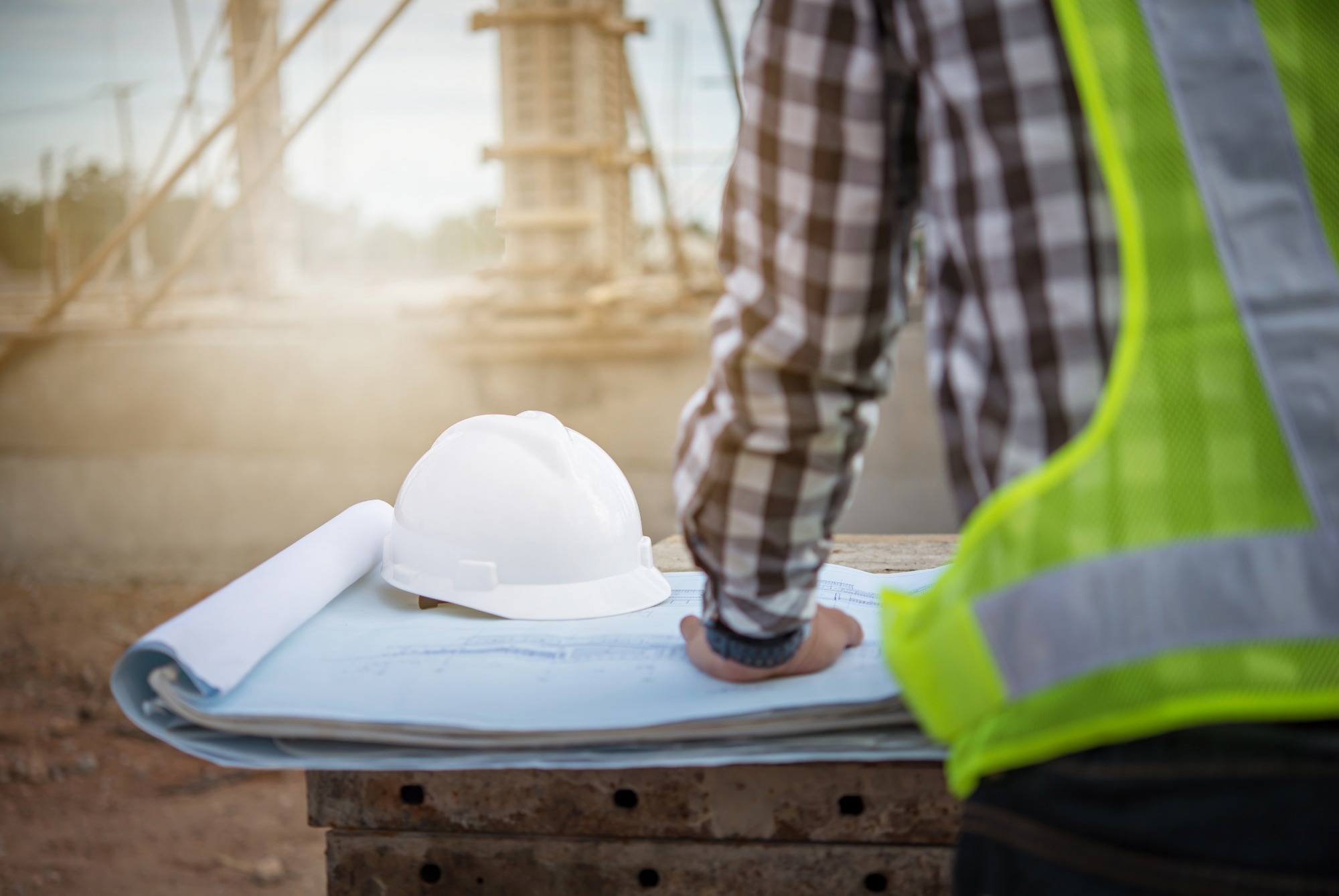 Engineer working on building site.