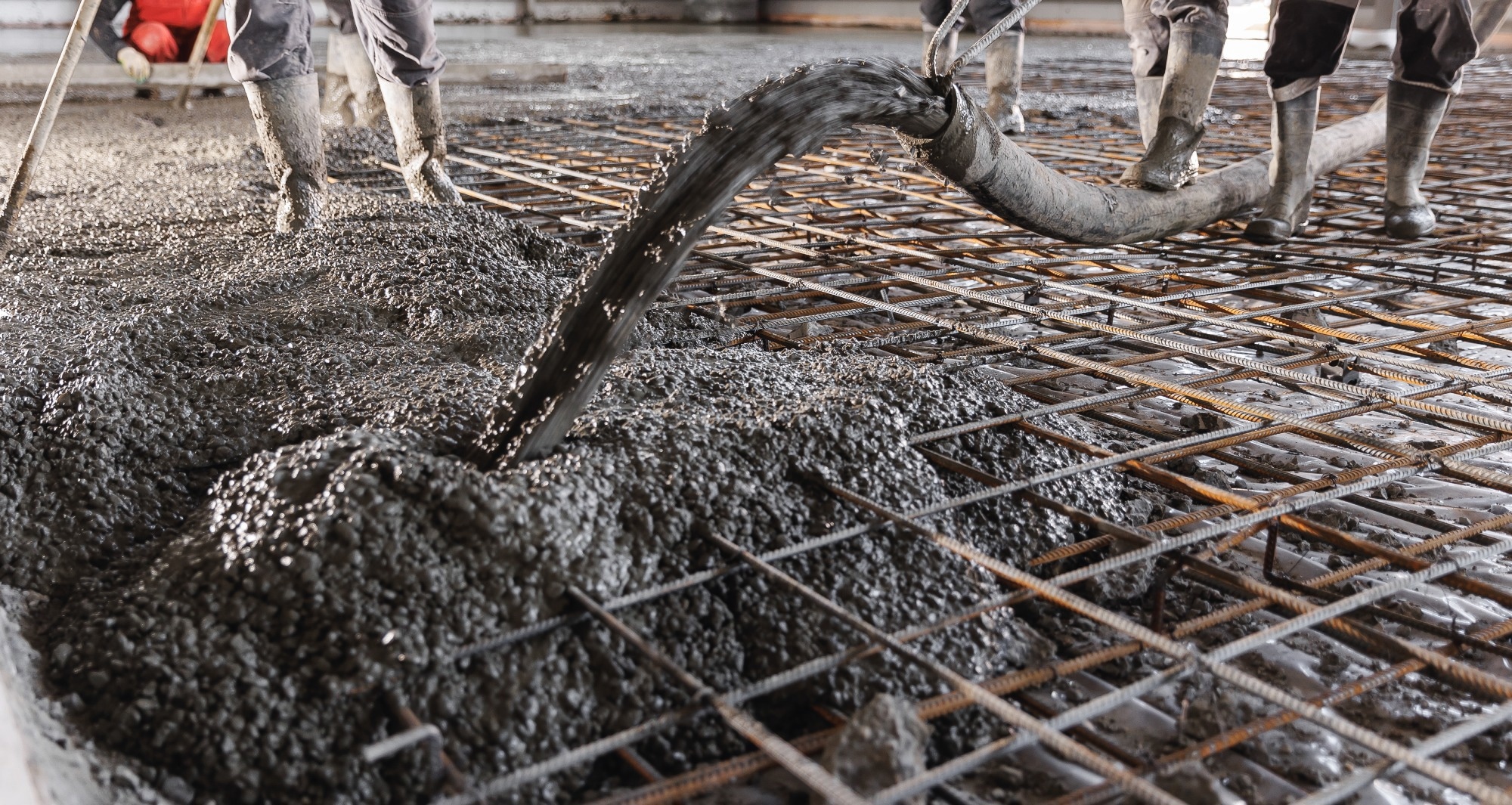 Workers work on concrete concreting floors of buildings in construction site, Concept pouring cement build house.