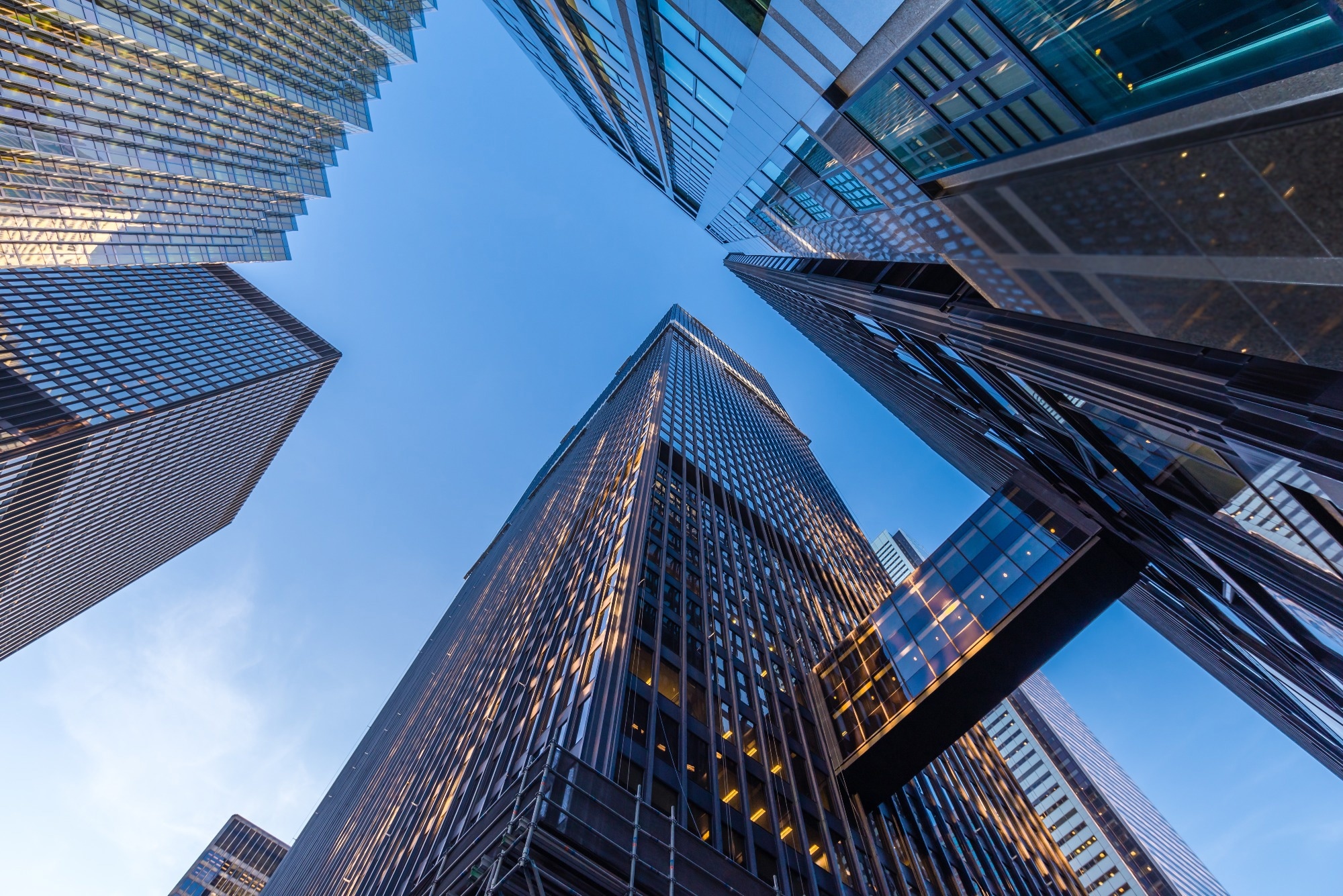 Office buildings stretch up to the blue sky in the financial district in downtown Toronto Ontario Canada.