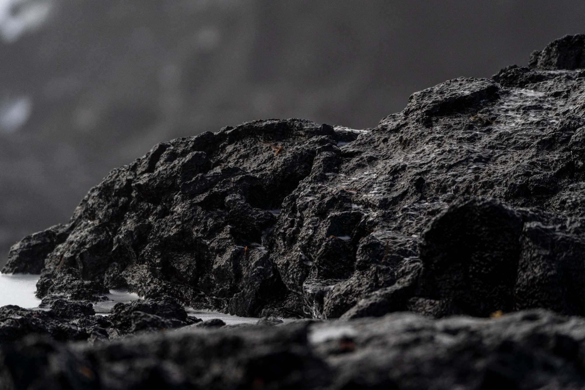 Close up of black lava stones.