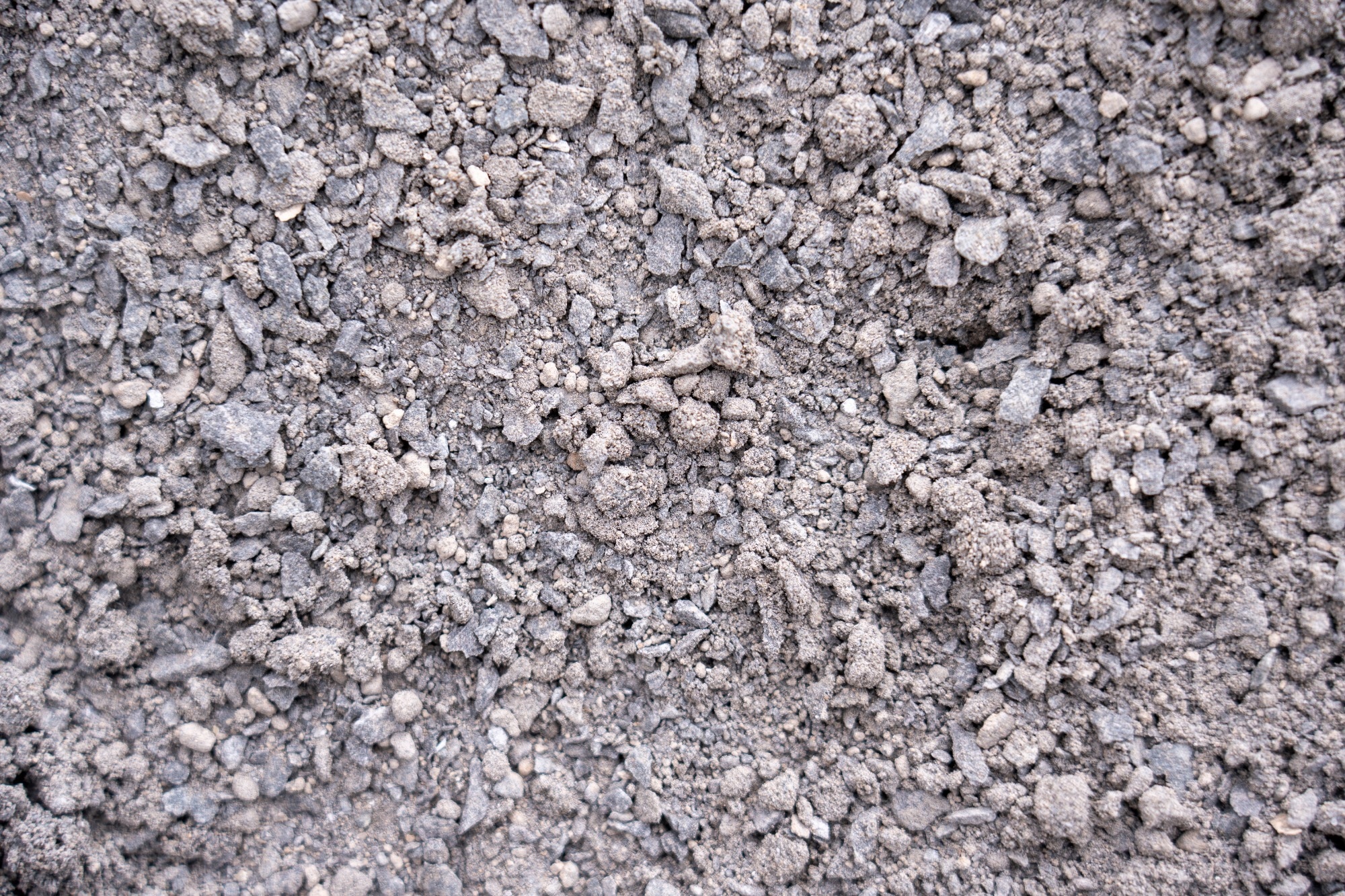 Black basalt fine aggregate, basalt aggregate background image.