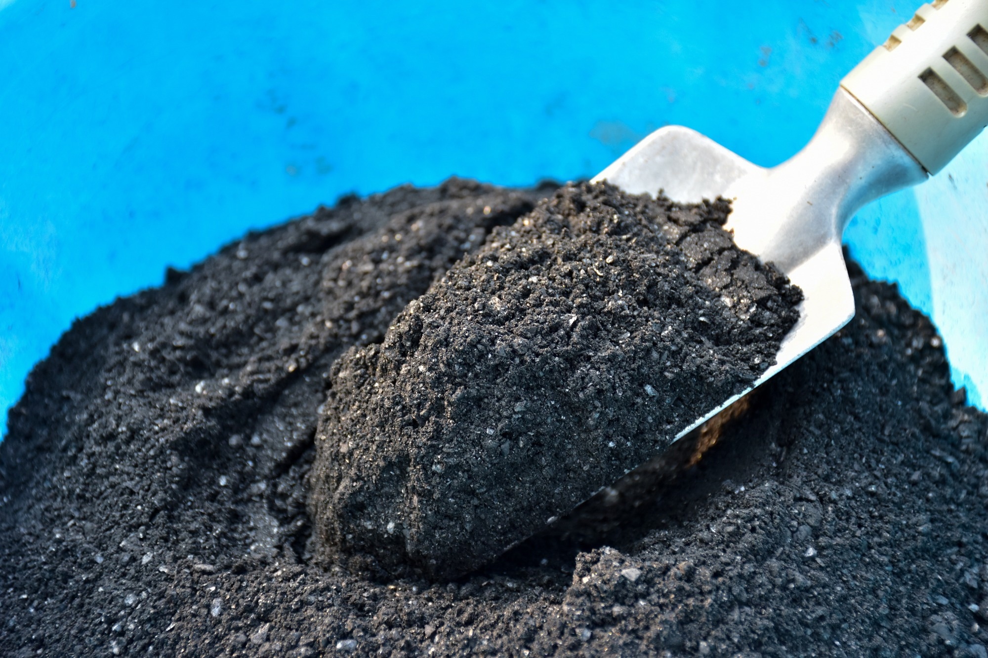 Charcoal (biochar) on a shovel.
