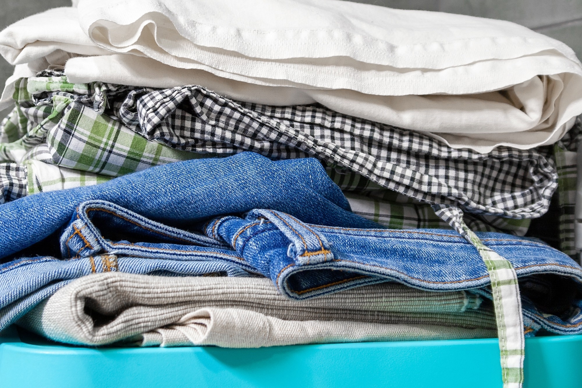 Closeup view of waste clothes folded up in a pile.