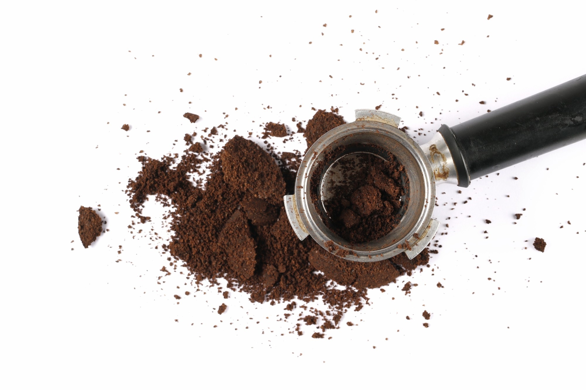 An espresso holder and ground coffee waste.