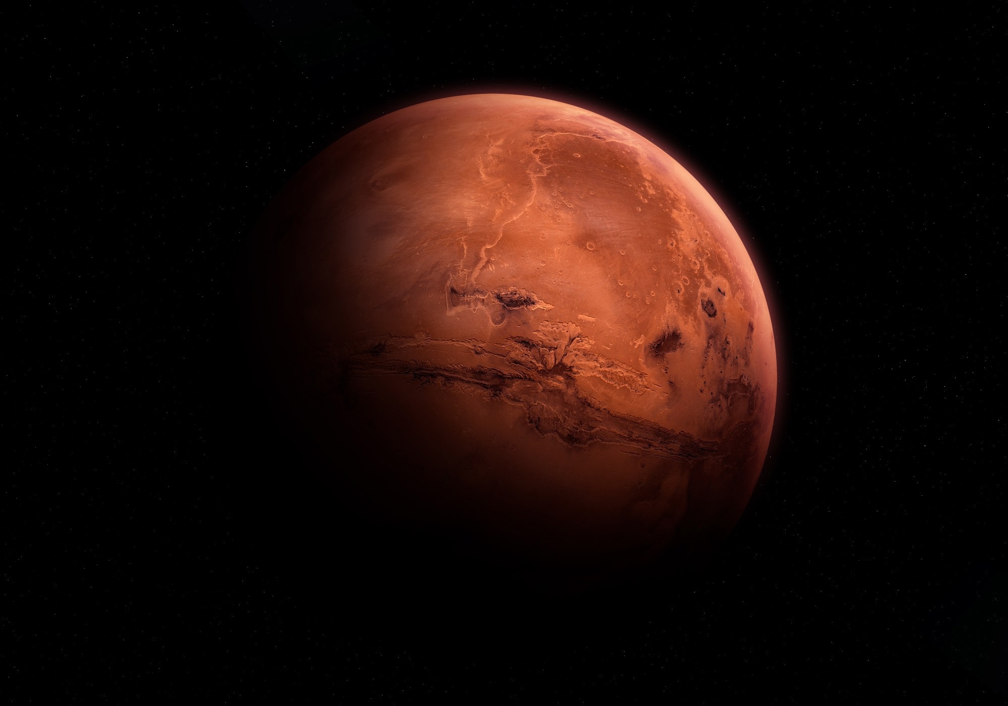 View of the planet Mars against the darkness of space, showing its reddish surface and atmospheric features. Image elements furnished by NASA.