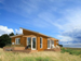 Green Builder Sells Two Homes; Signs Distribution Agreement with Indigo Island