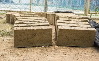 Recycled Glass Found to Strengthen Compressed Earth Blocks for Sustainable Construction